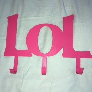 Metal pink jacket/coat/scarf holder.